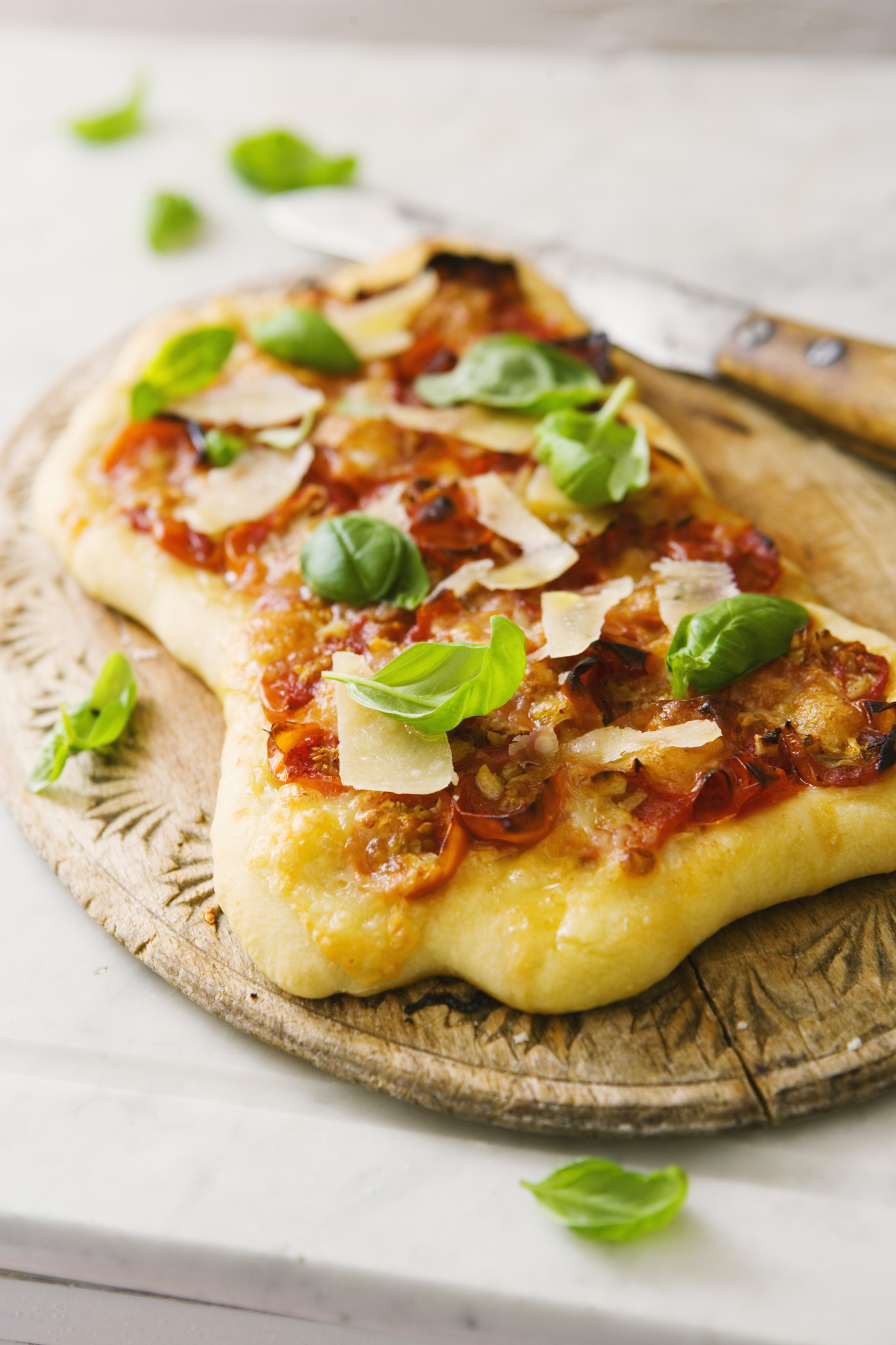a pizza on a wooden board