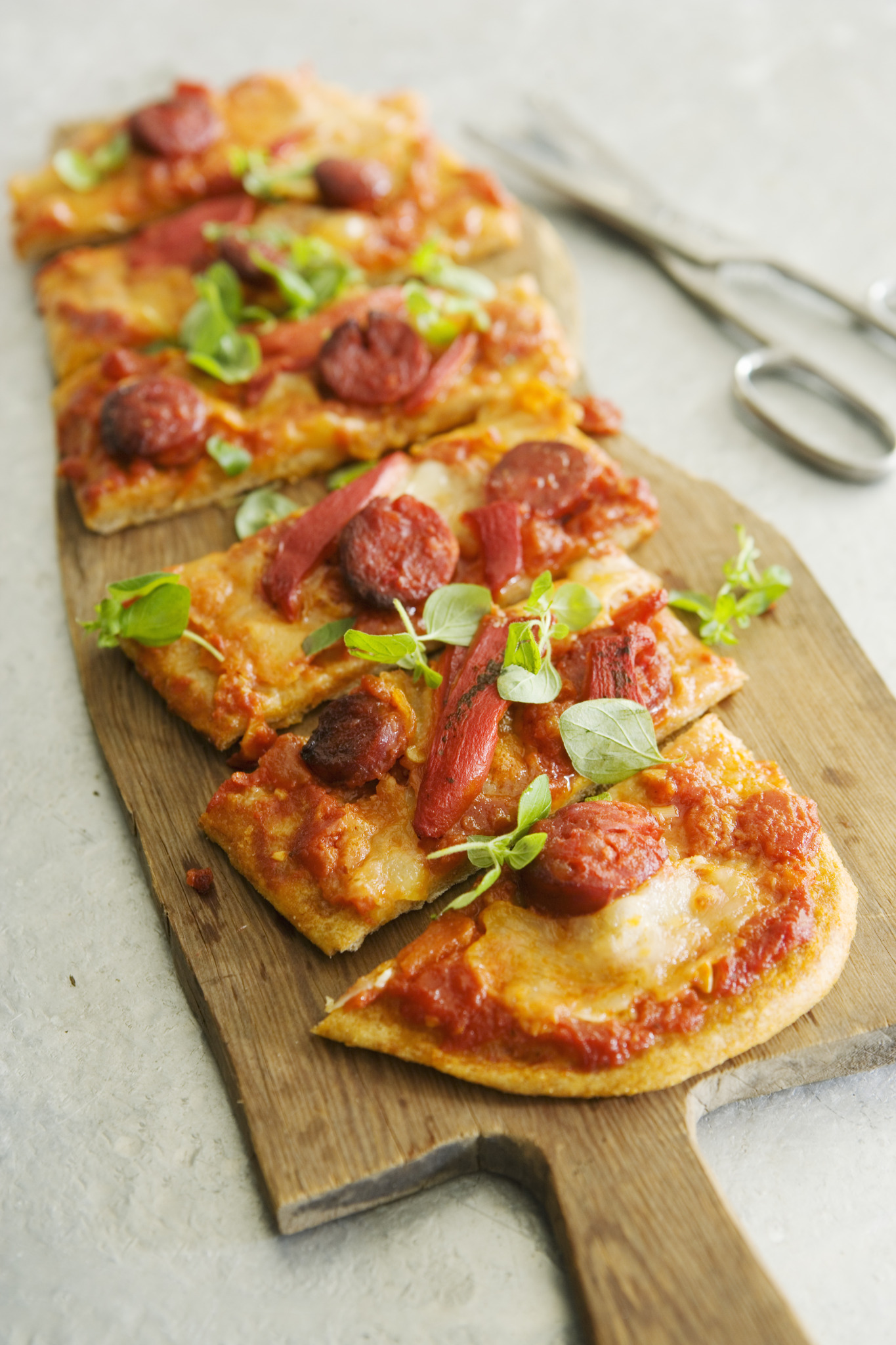 a pizza on a wooden board