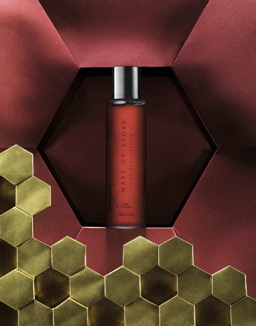 a bottle of liquid in a red box