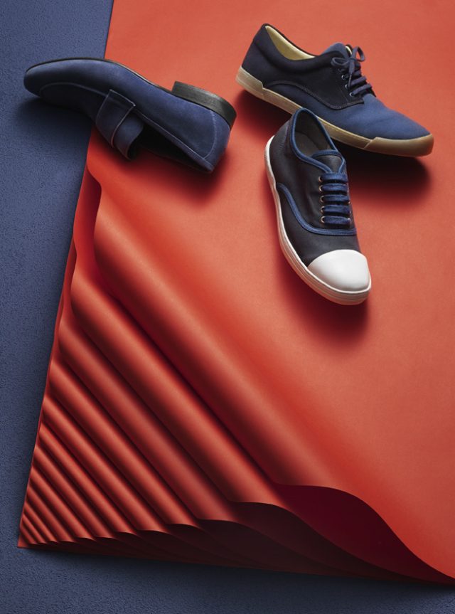 a pair of shoes on a red and blue surface