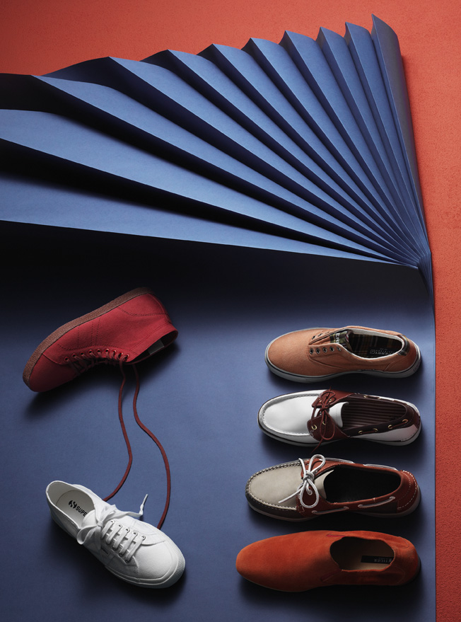 a group of shoes on a blue surface