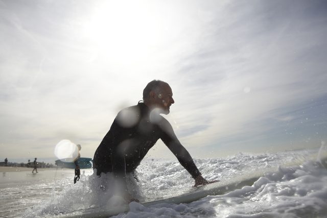 a man on a surfboard in the ocean