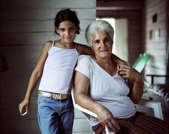 a girl and an older woman posing for a picture