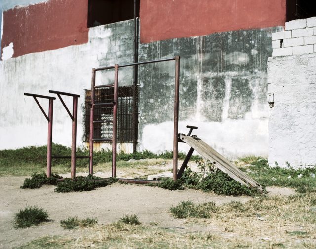 a playground equipment in front of a building