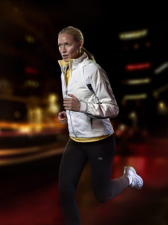 a woman running in a city