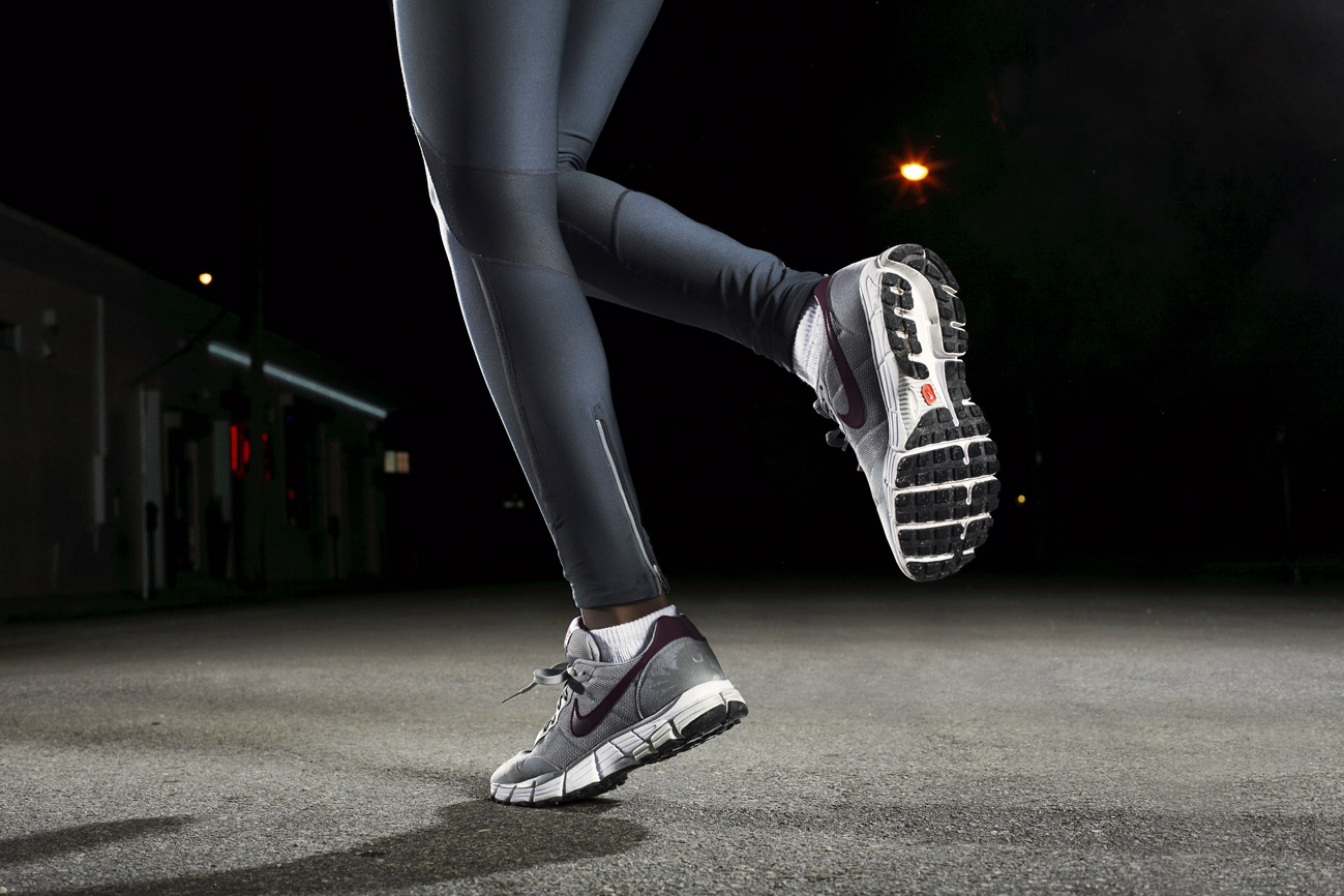 a person's legs and feet in a running pose