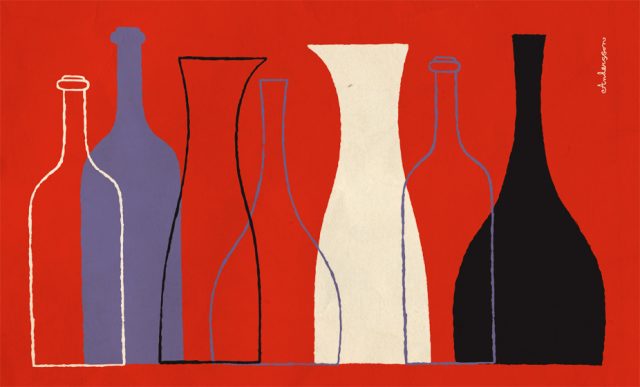 a group of bottles on a red background