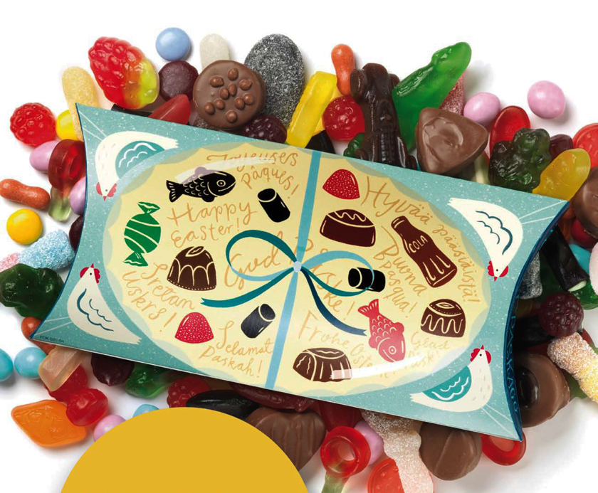 a box of candy on top of a pile of candy