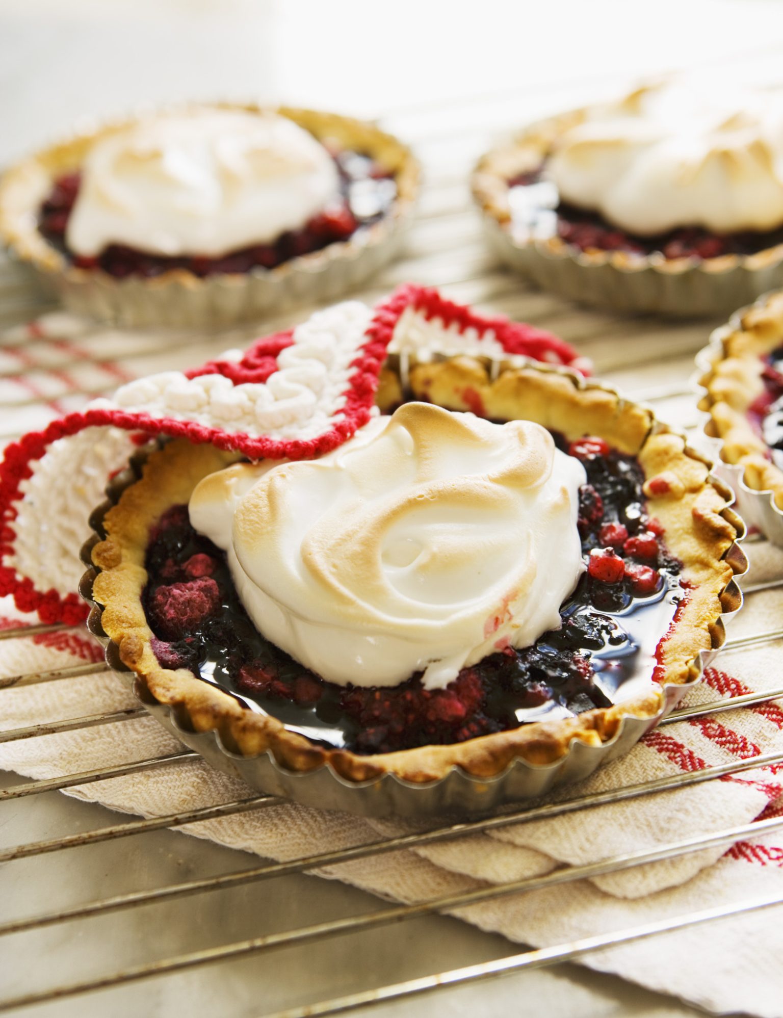 a group of desserts on a cooling rack