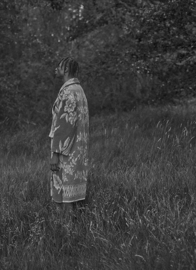 a woman standing in a field