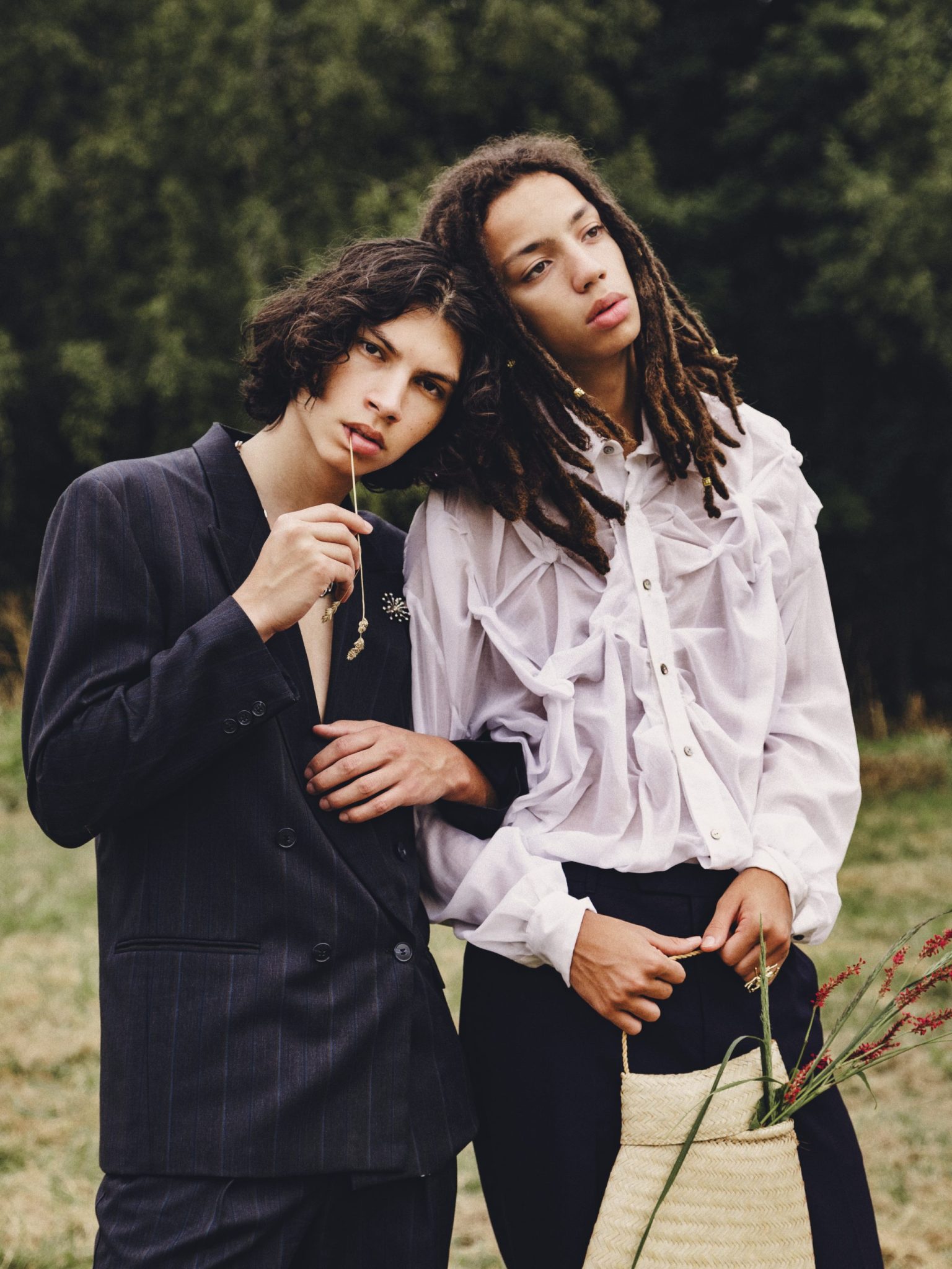 two men standing in a field