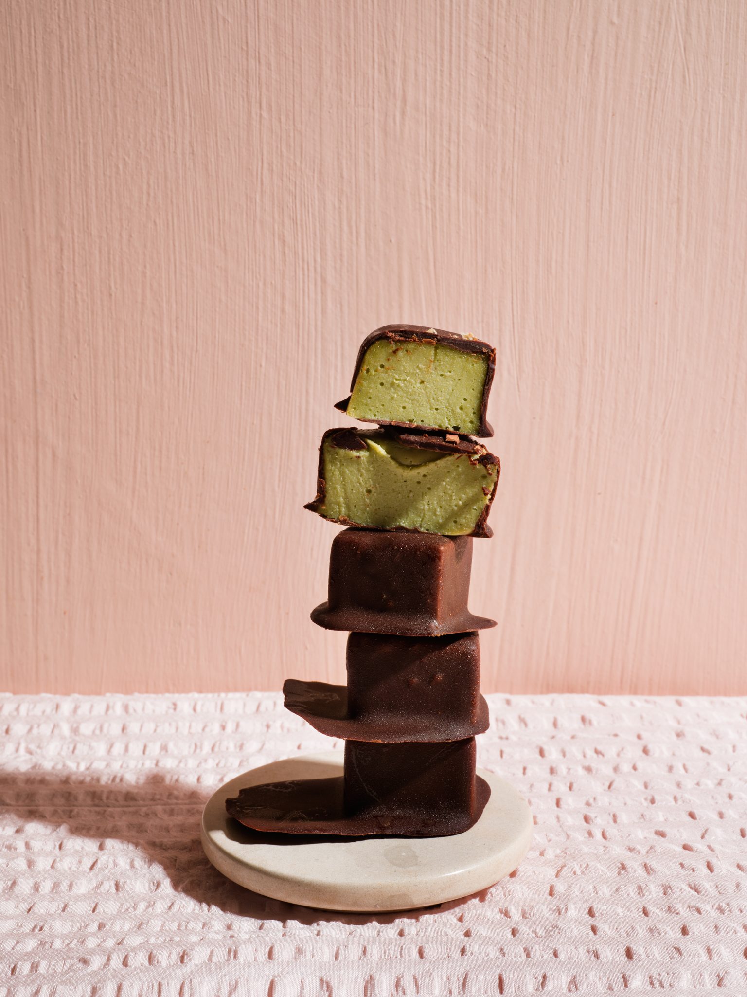 a stack of chocolate and green ice cream