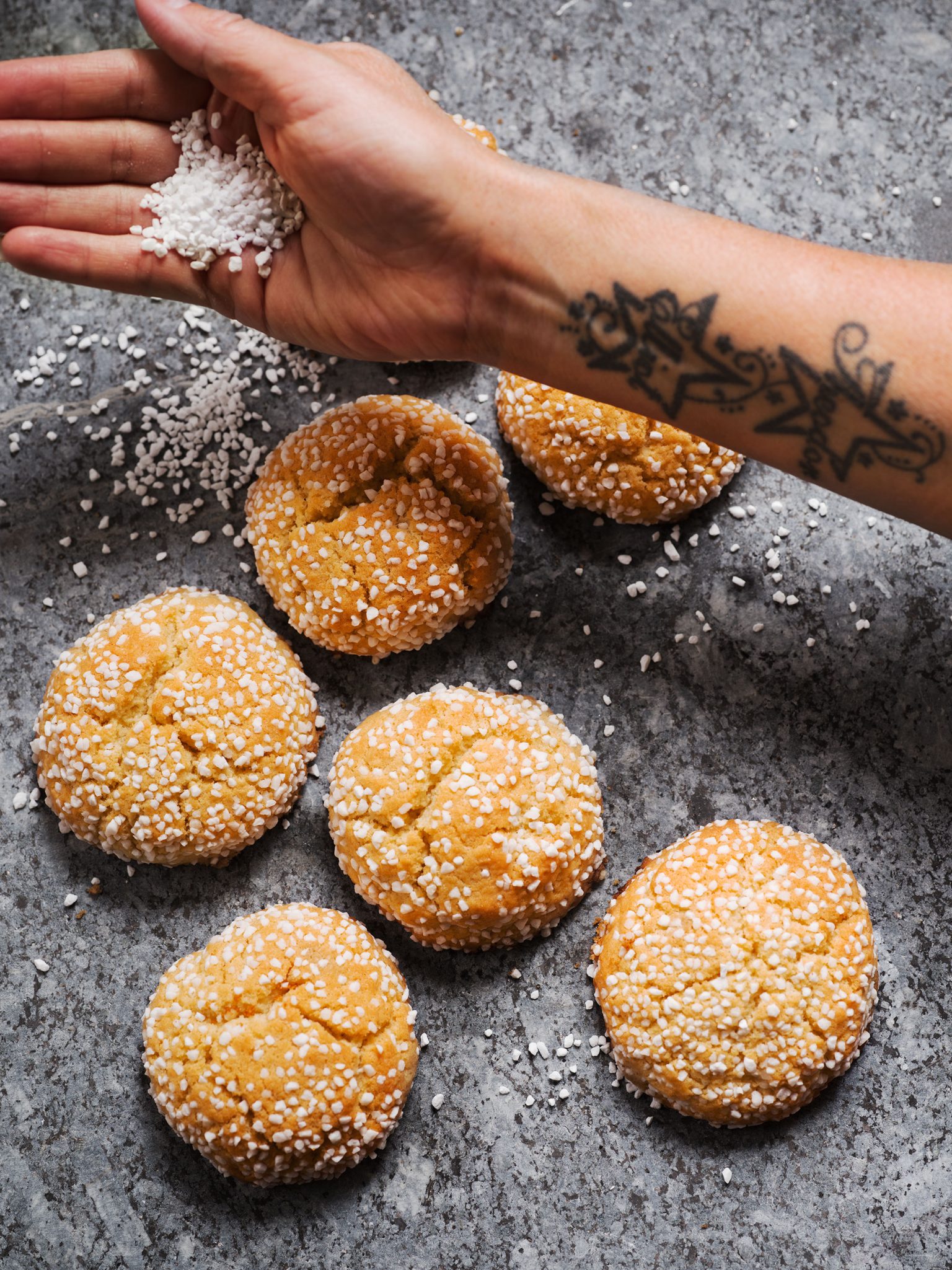 a hand holding a handful of cookies