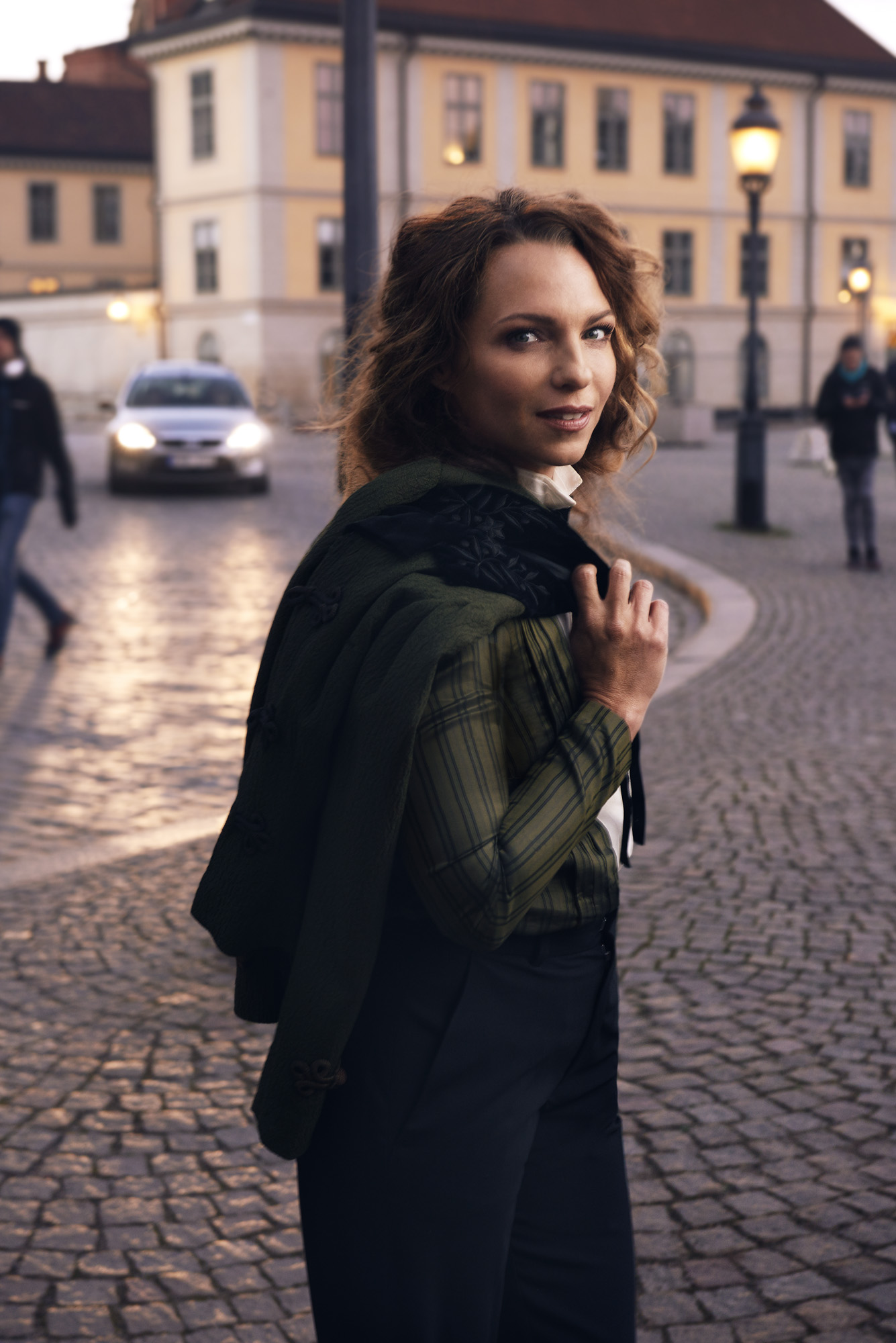 a woman standing on a street