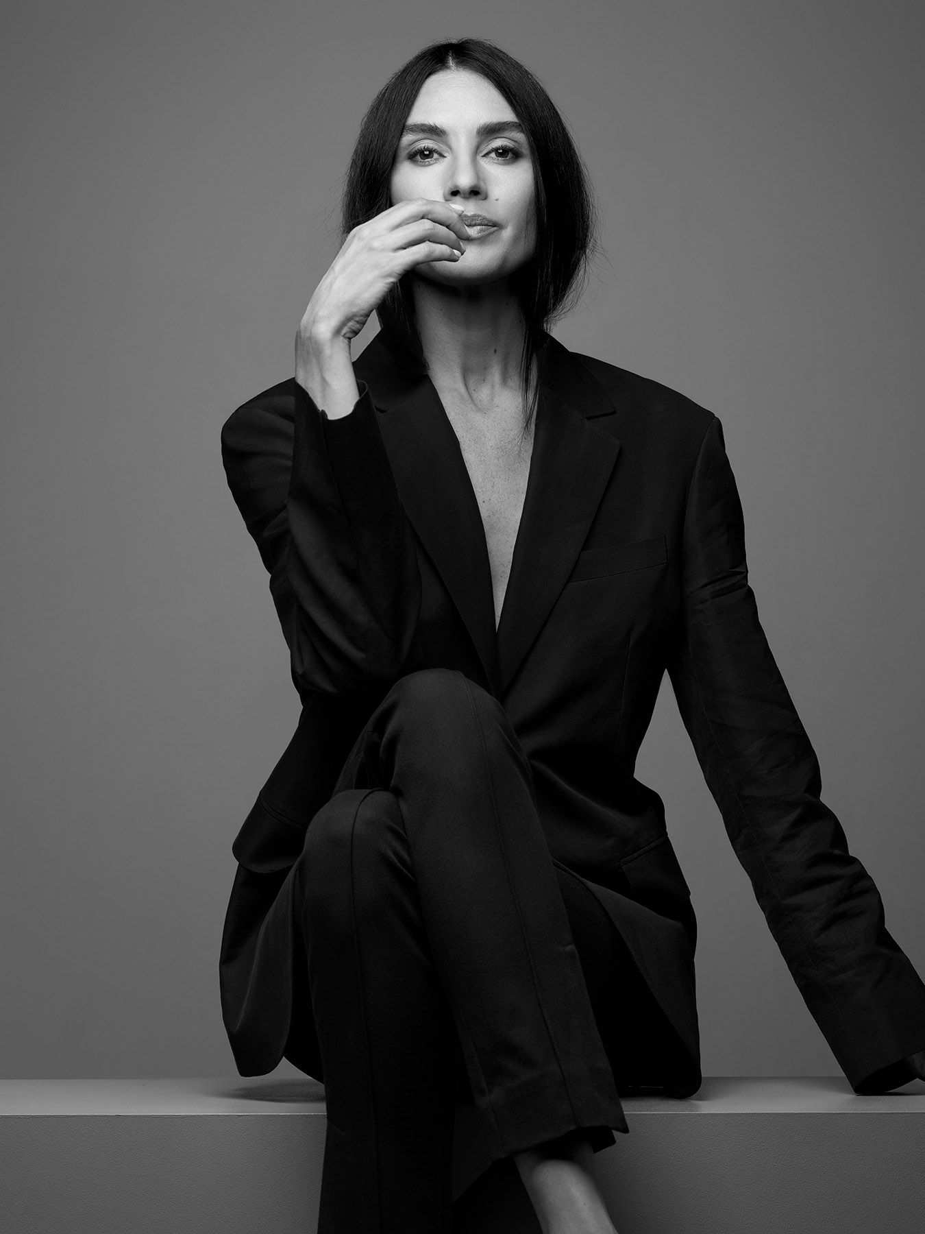 a woman in a black suit