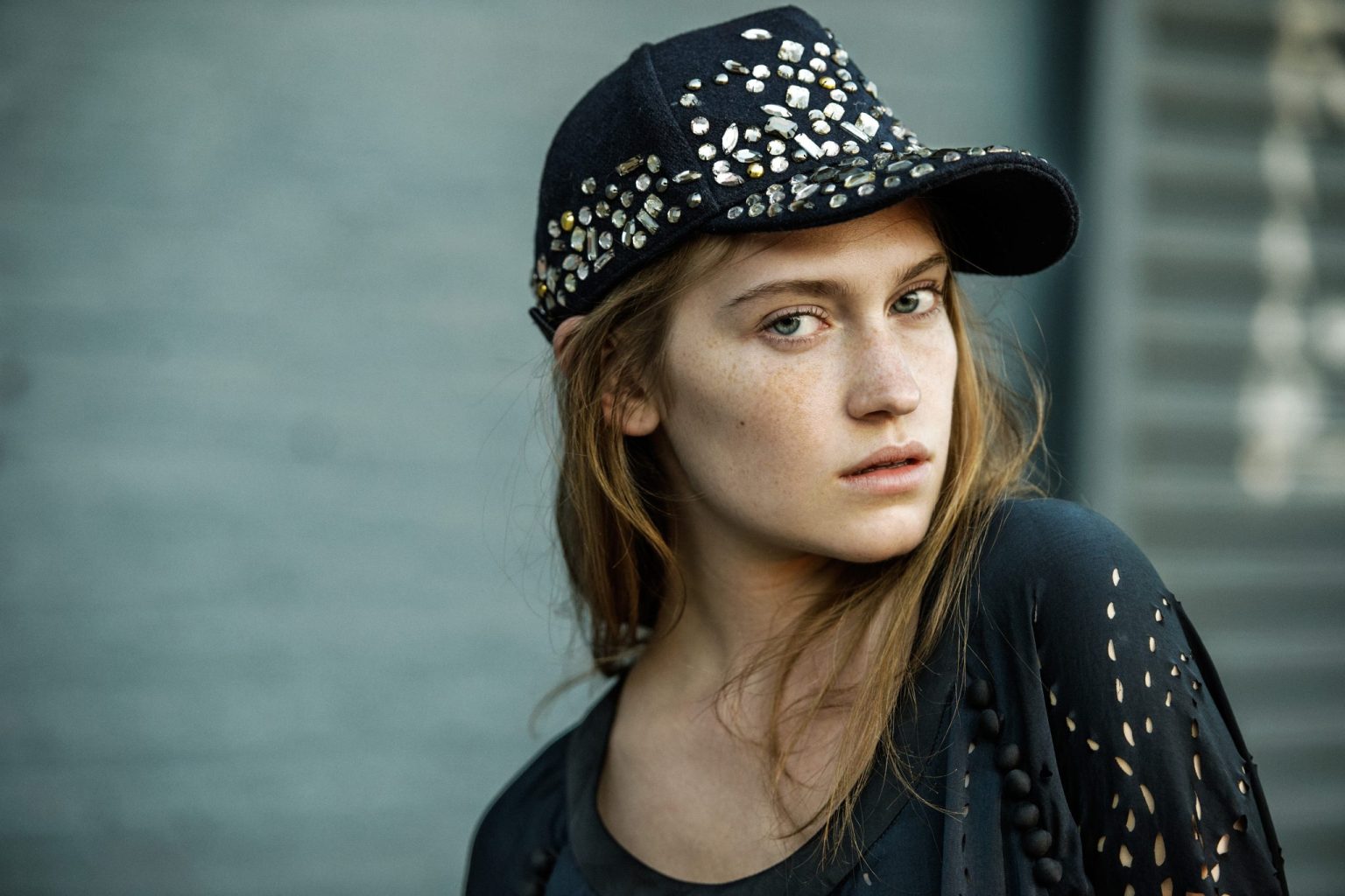 a woman wearing a black hat