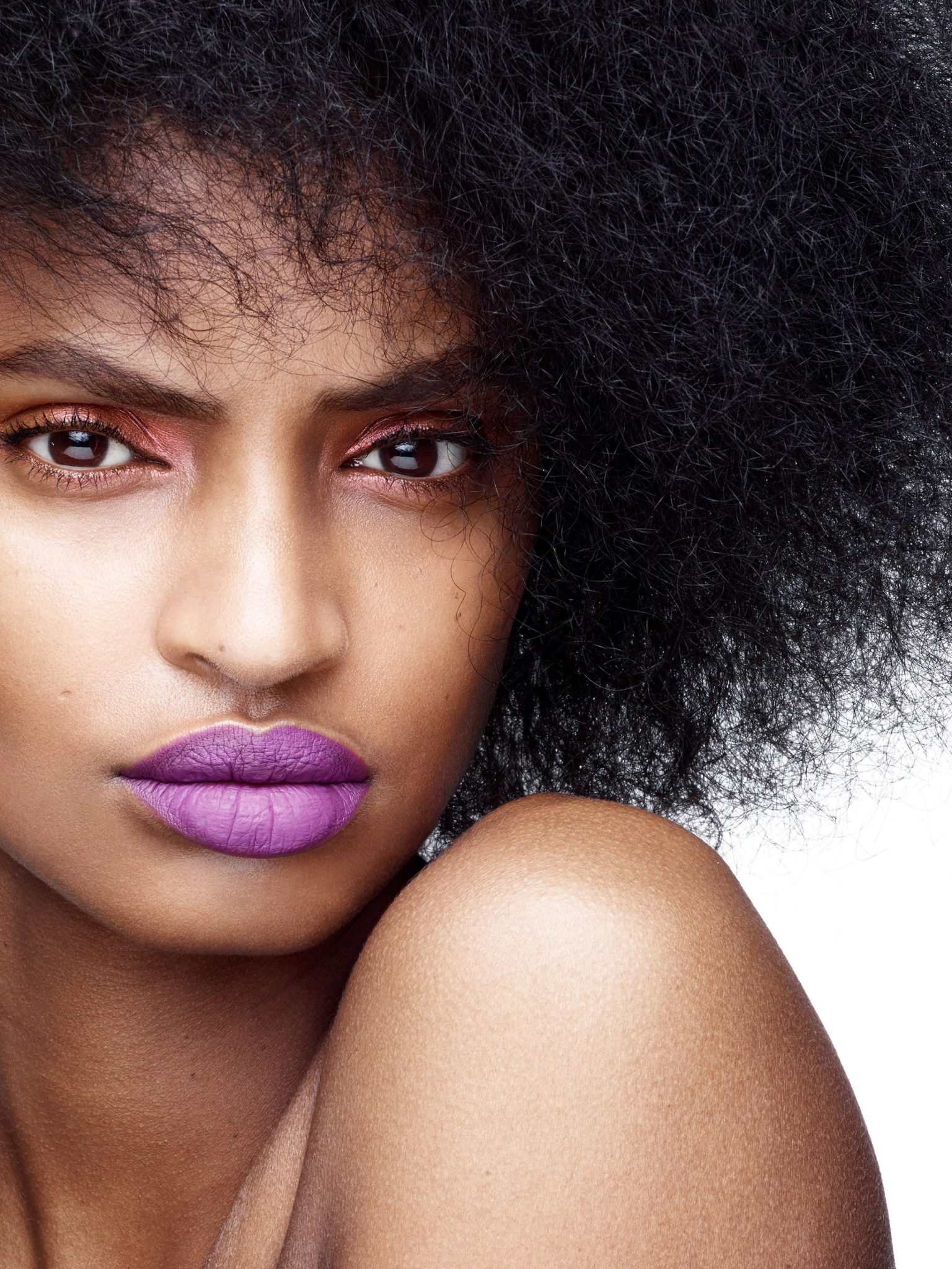 a woman with purple lipstick