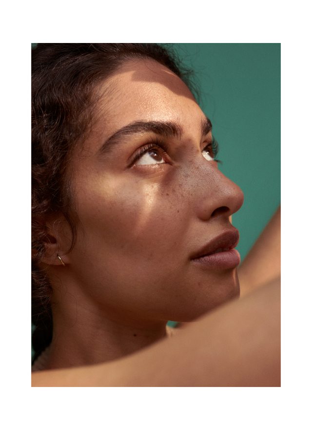 a woman looking up to the side