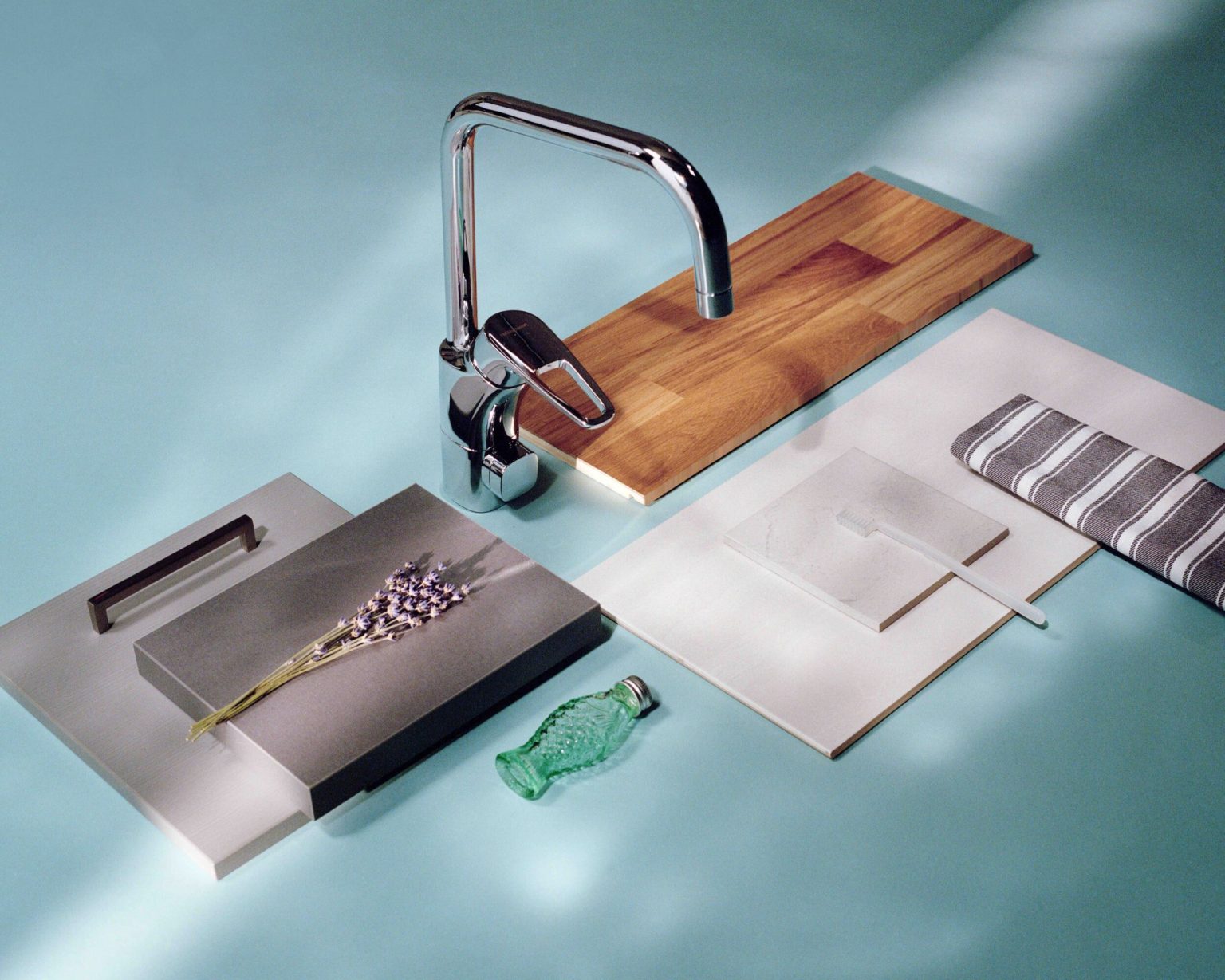 a faucet and cutting board with a flower