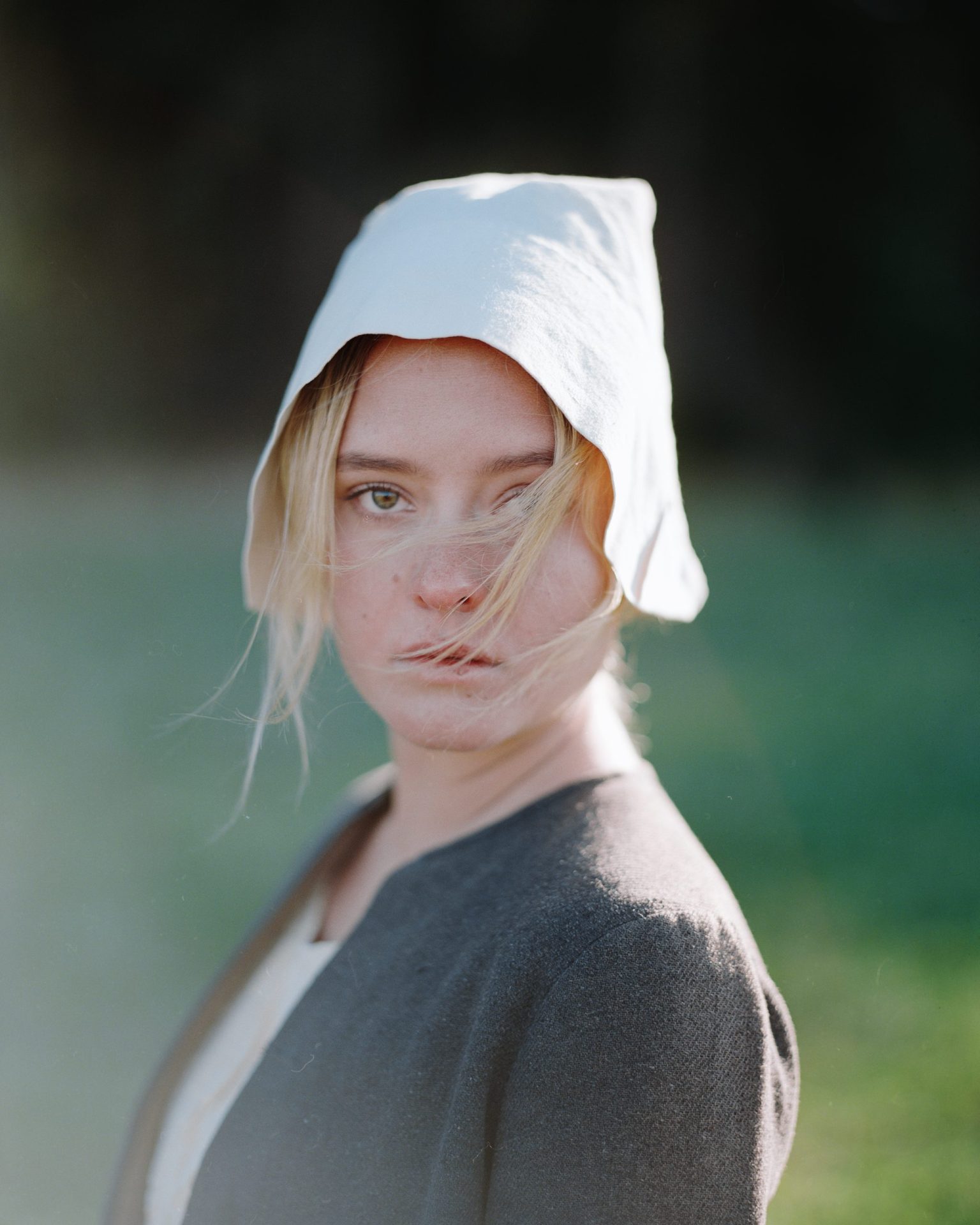 a woman with a white hood