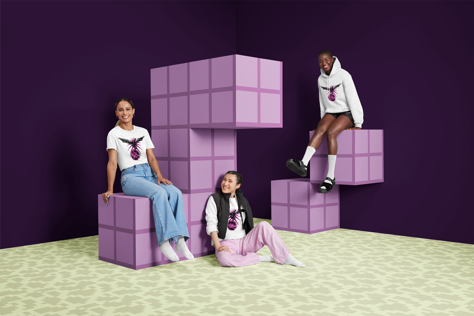 a group of women sitting on cubes