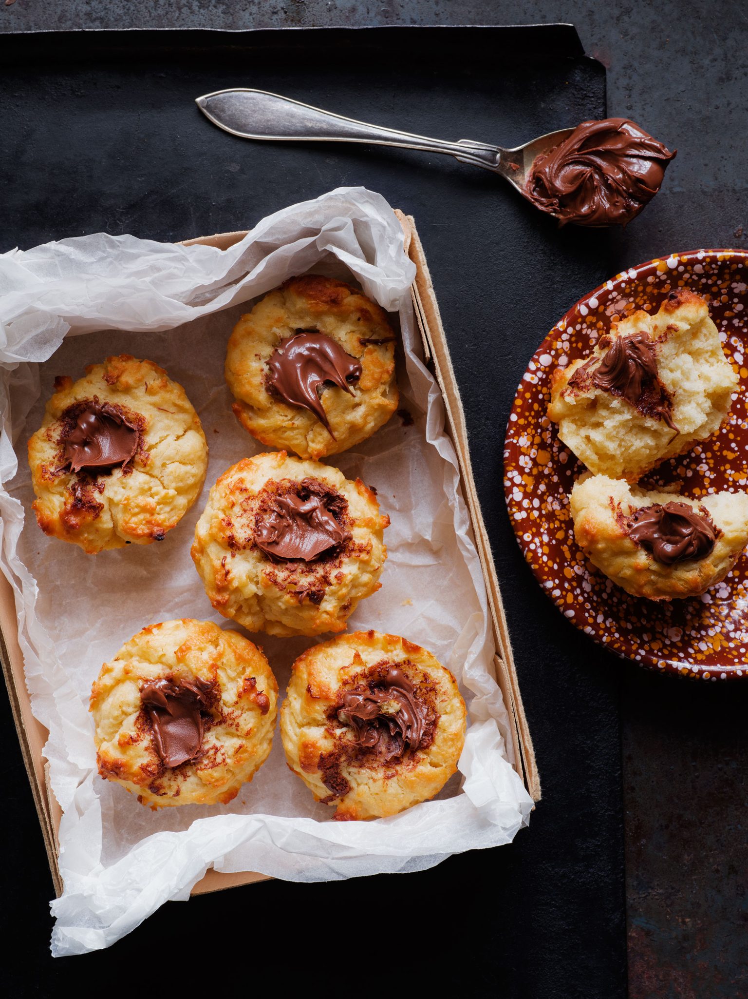 a box of muffins with chocolate spread