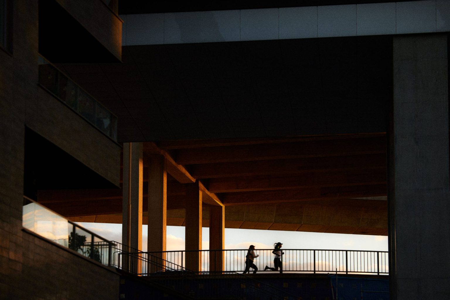 people walking on a bridge