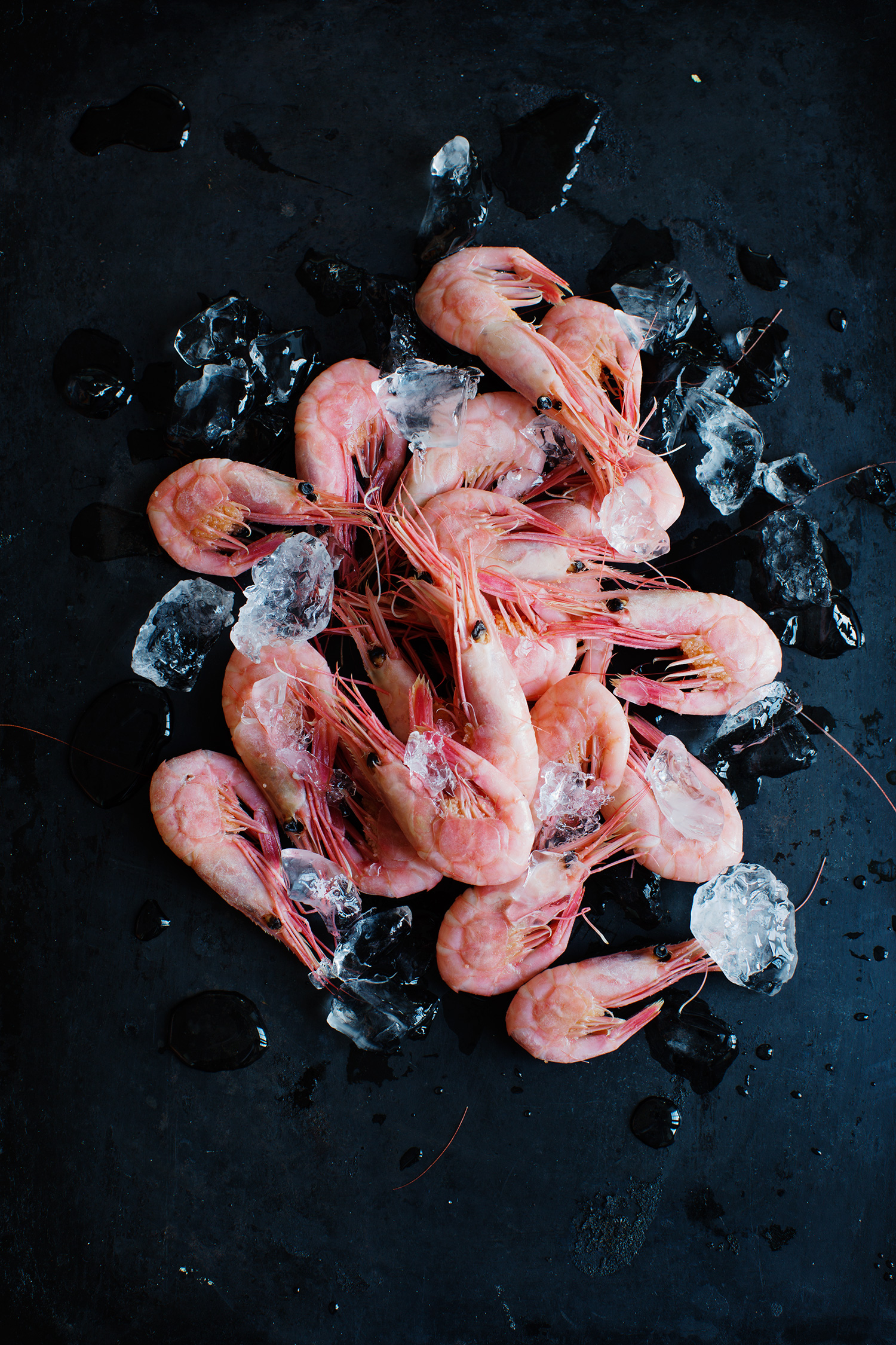 a pile of shrimp on ice