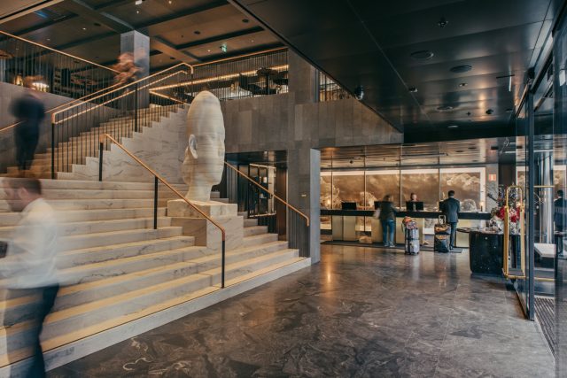 a marble staircase with a statue of a head