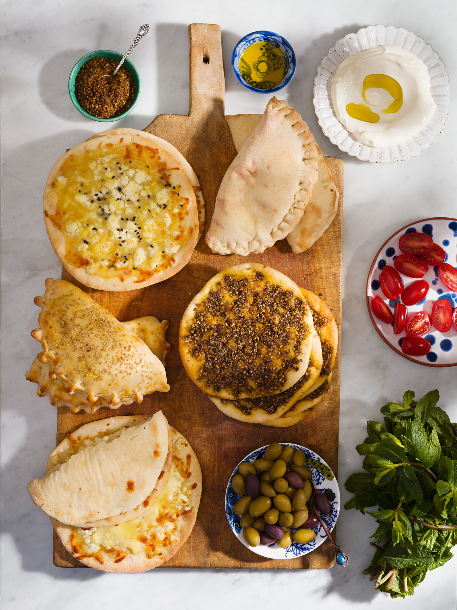 a pizzas on a cutting board