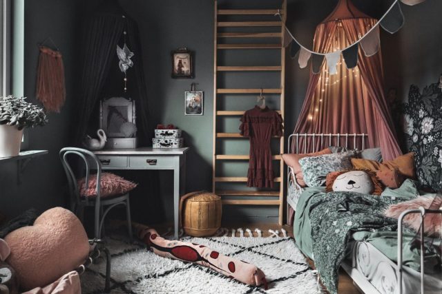 a room with a ladder and bed