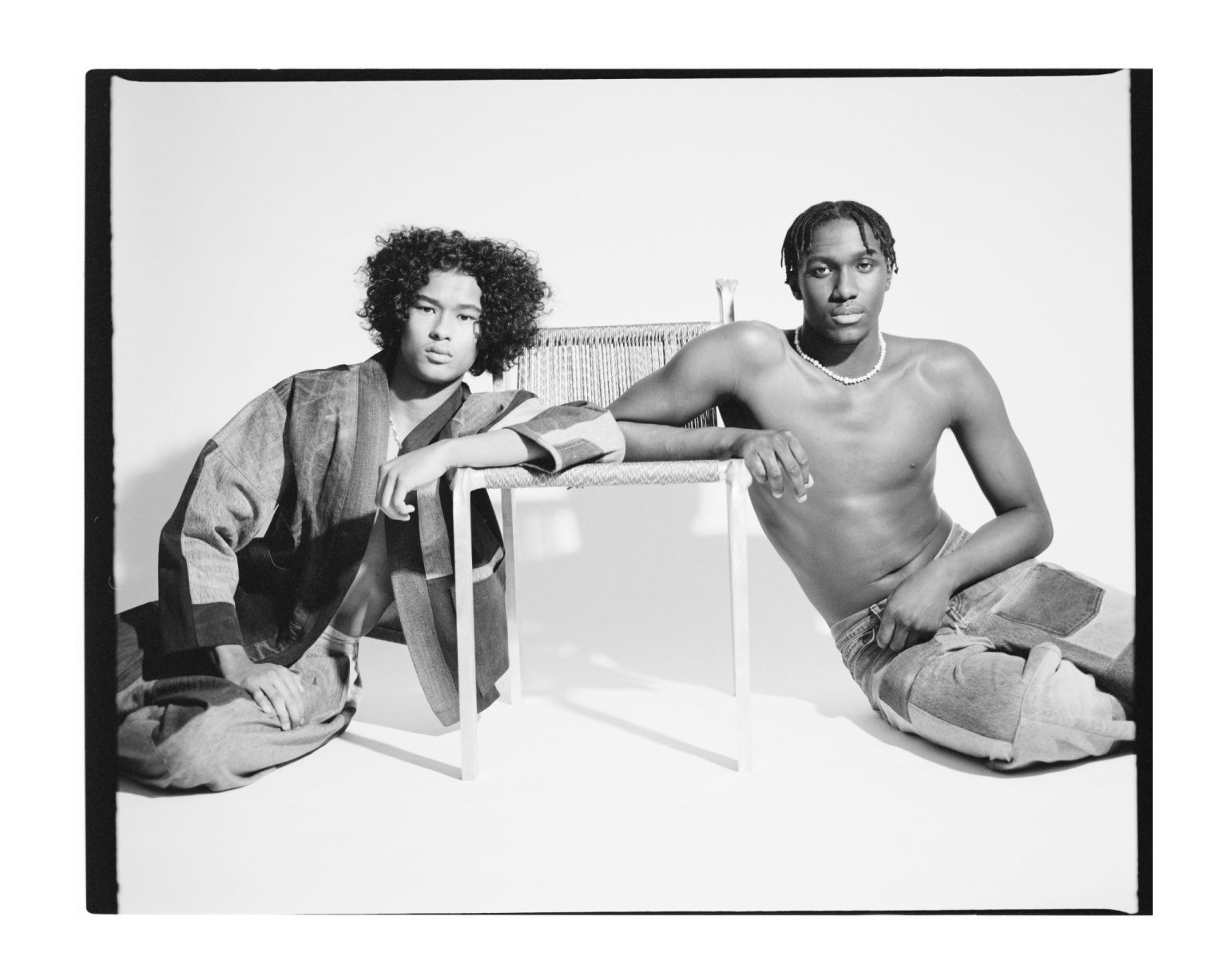 two men sitting next to each other