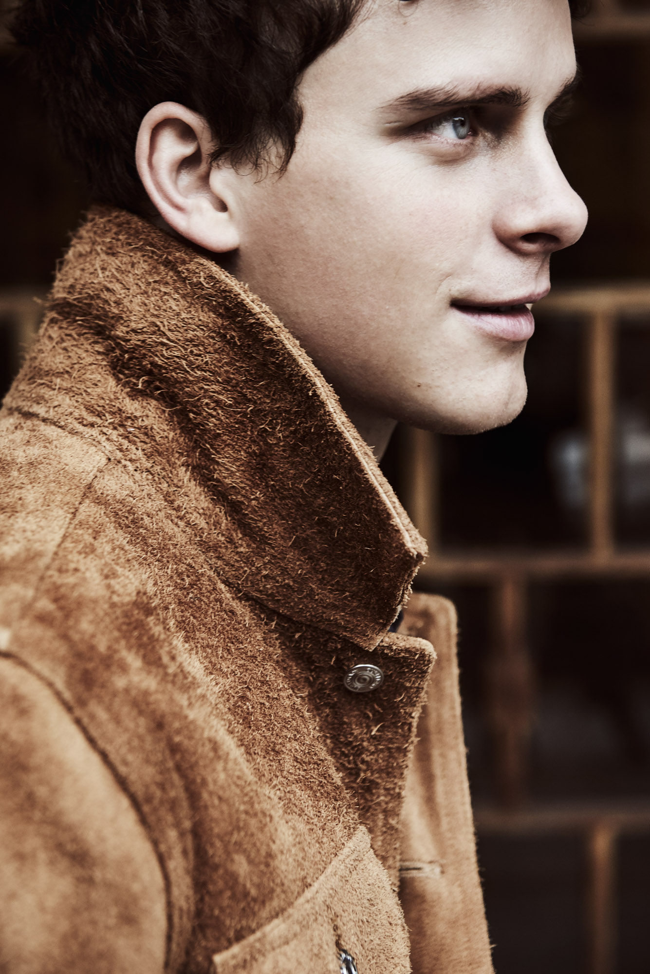 a man in a brown coat