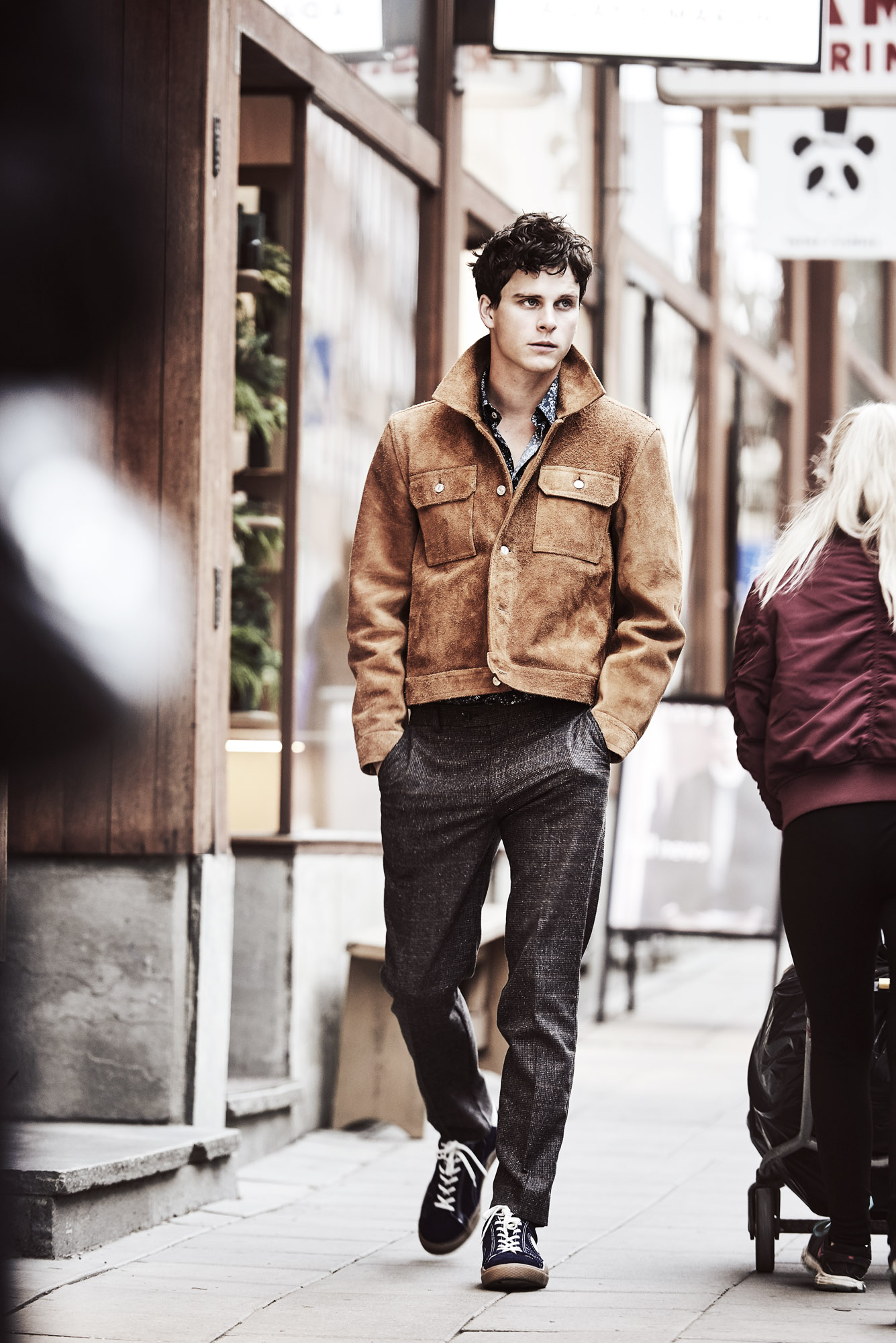 a man walking down a sidewalk