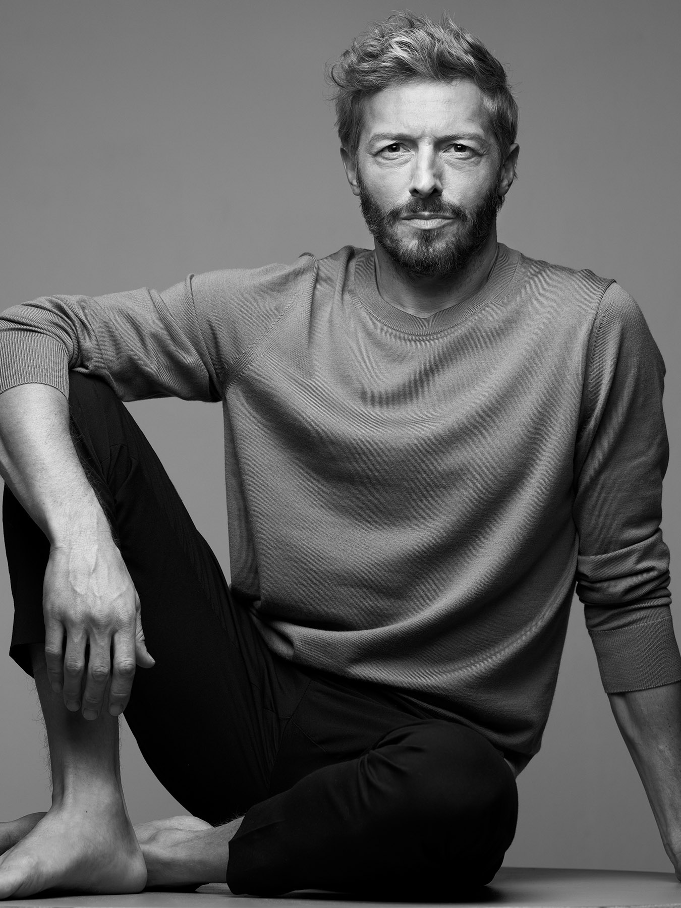 a man sitting on a stool