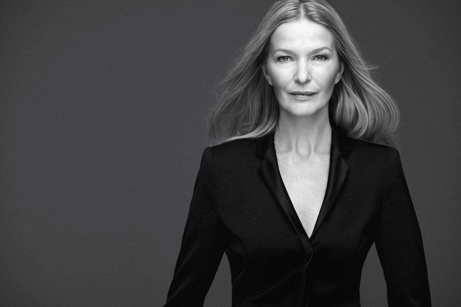 a woman in a black suit