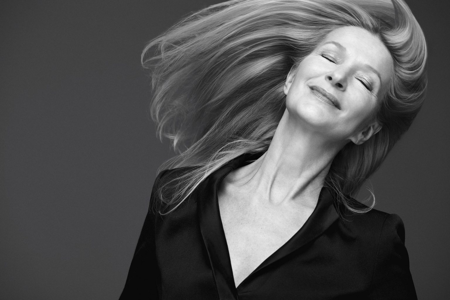 a woman with her eyes closed