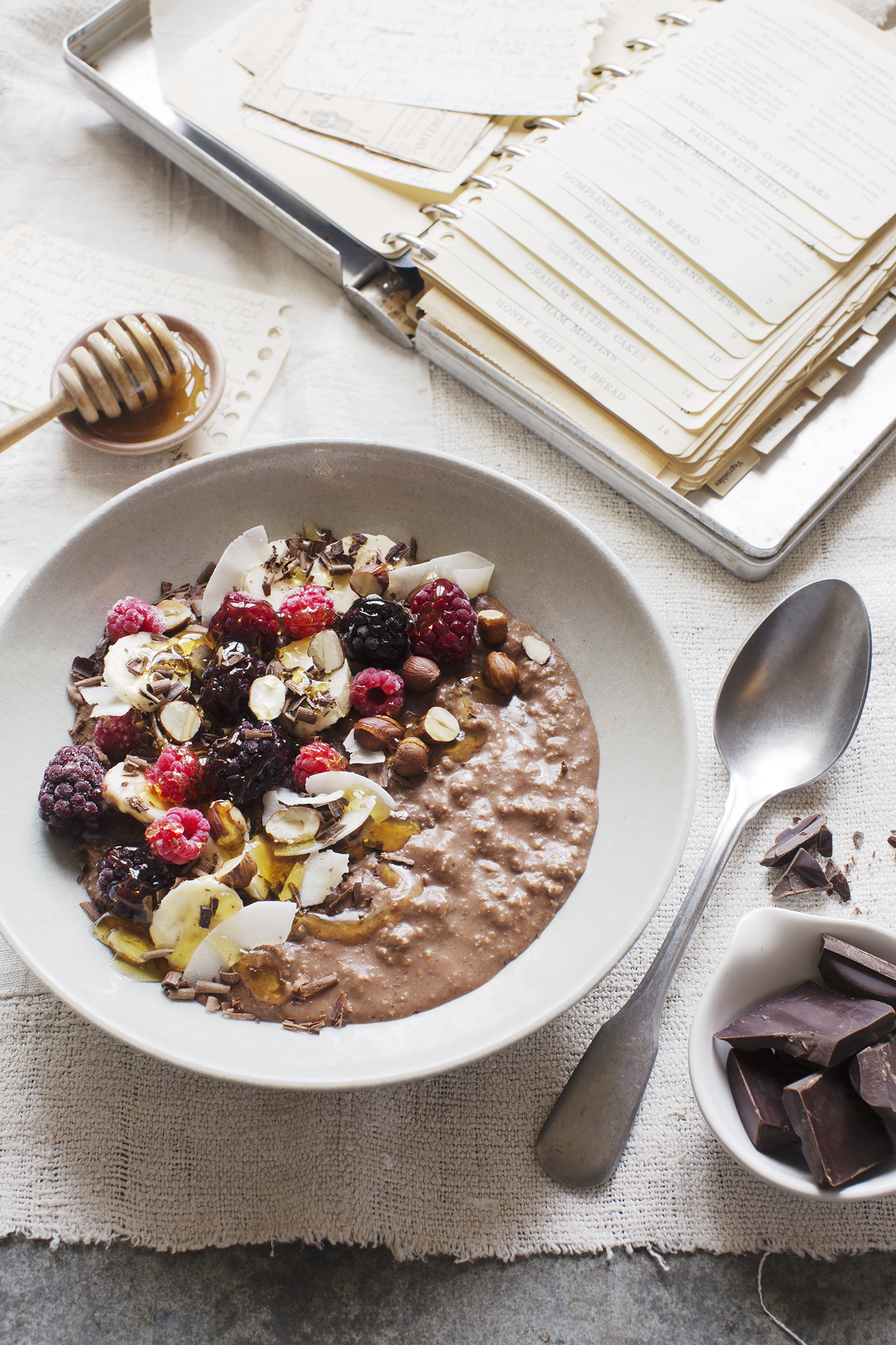 a bowl of oatmeal with berries and nuts
