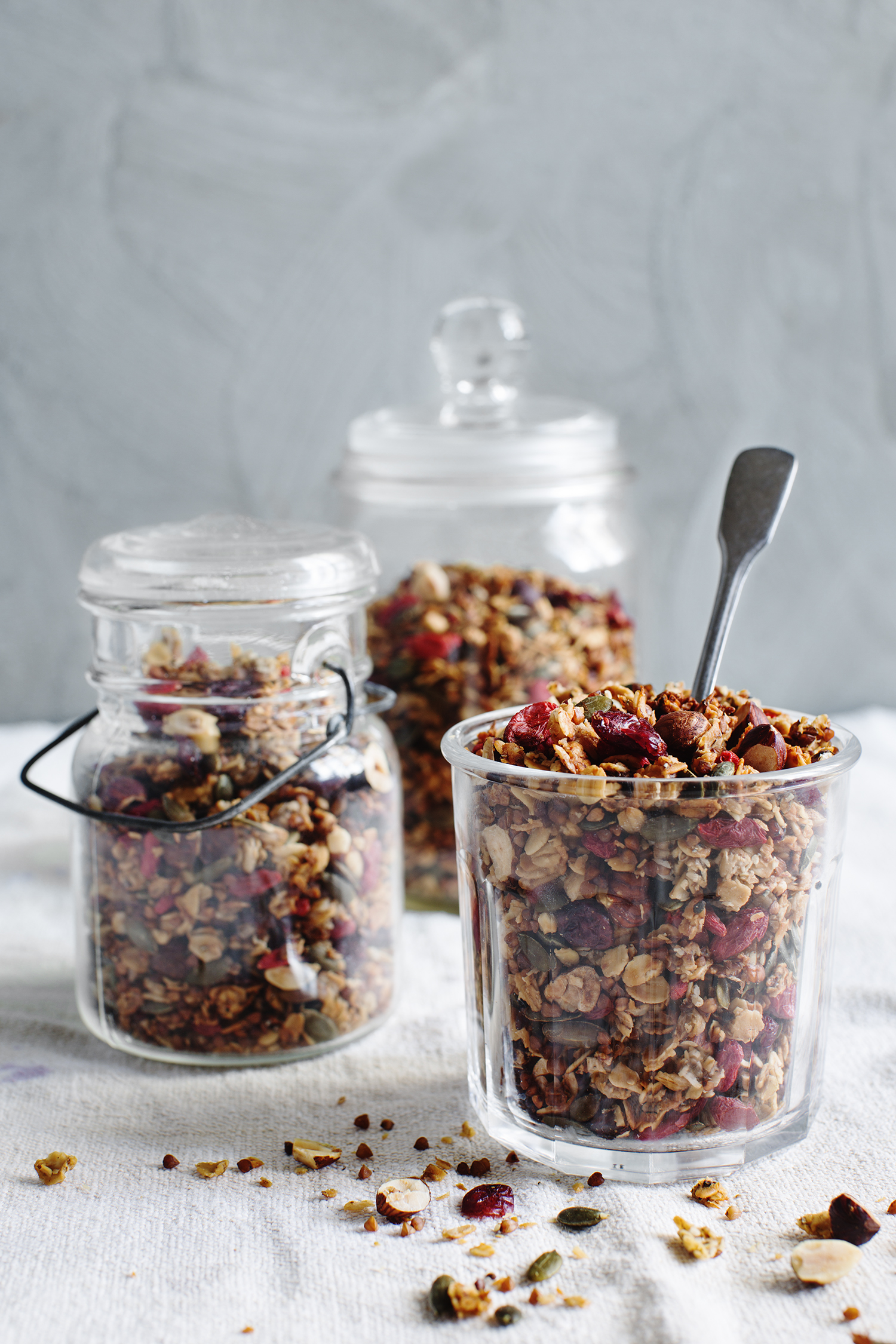 a group of glass jars with food in them