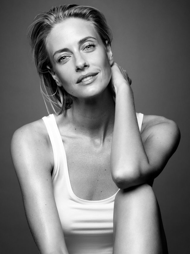 a woman in a white tank top