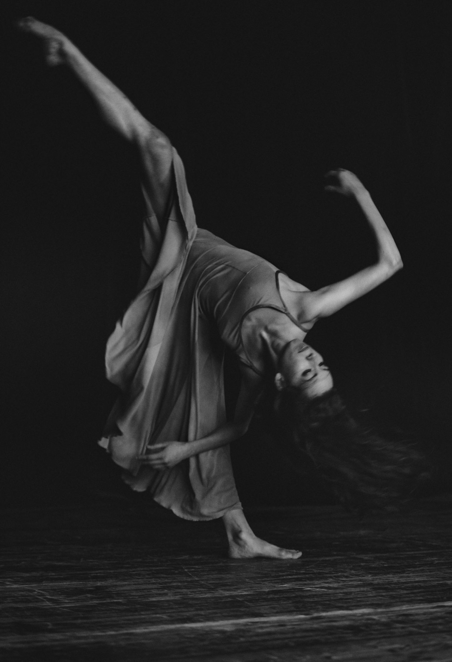 a woman dancing in a dress