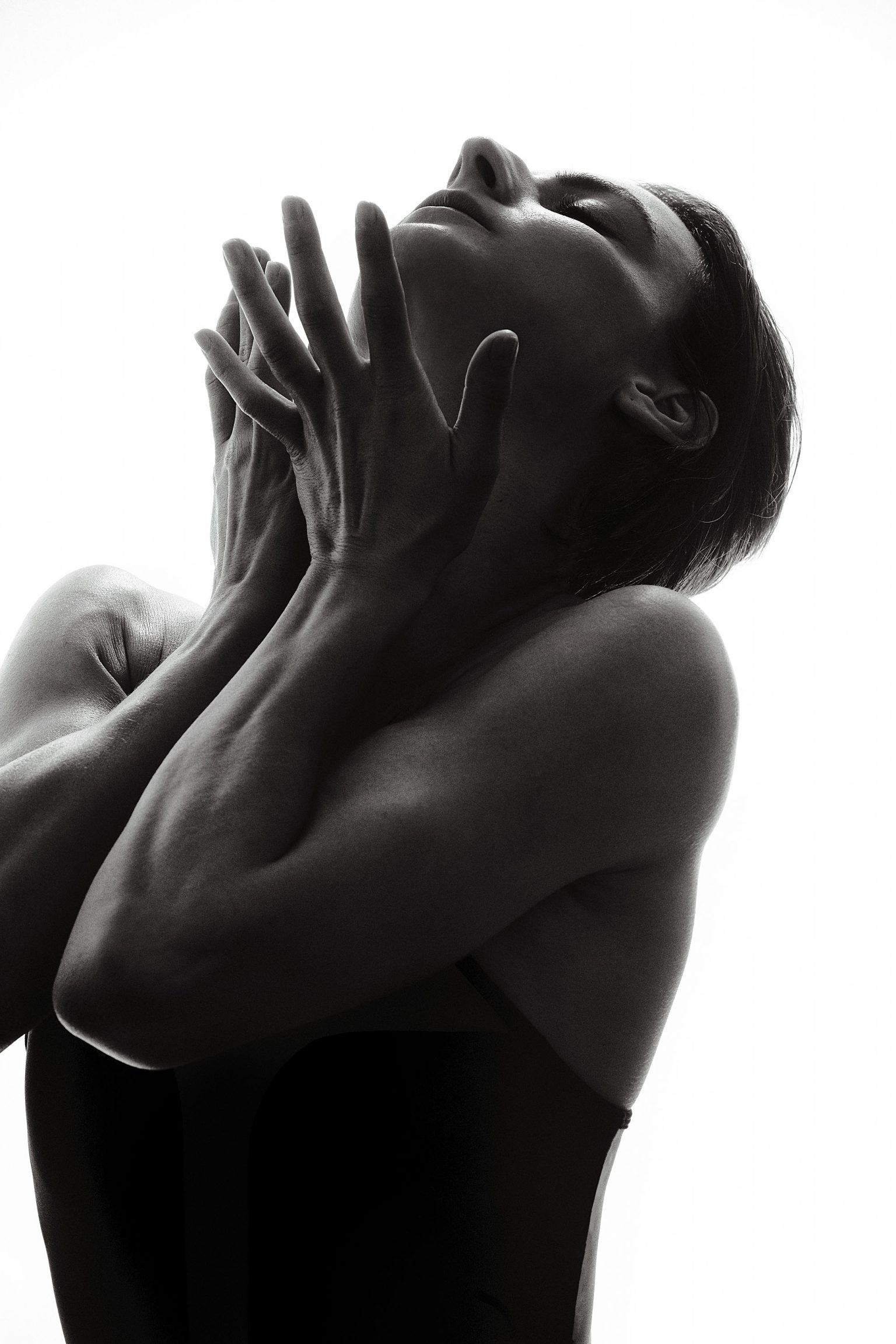 a woman with her hands in her mouth