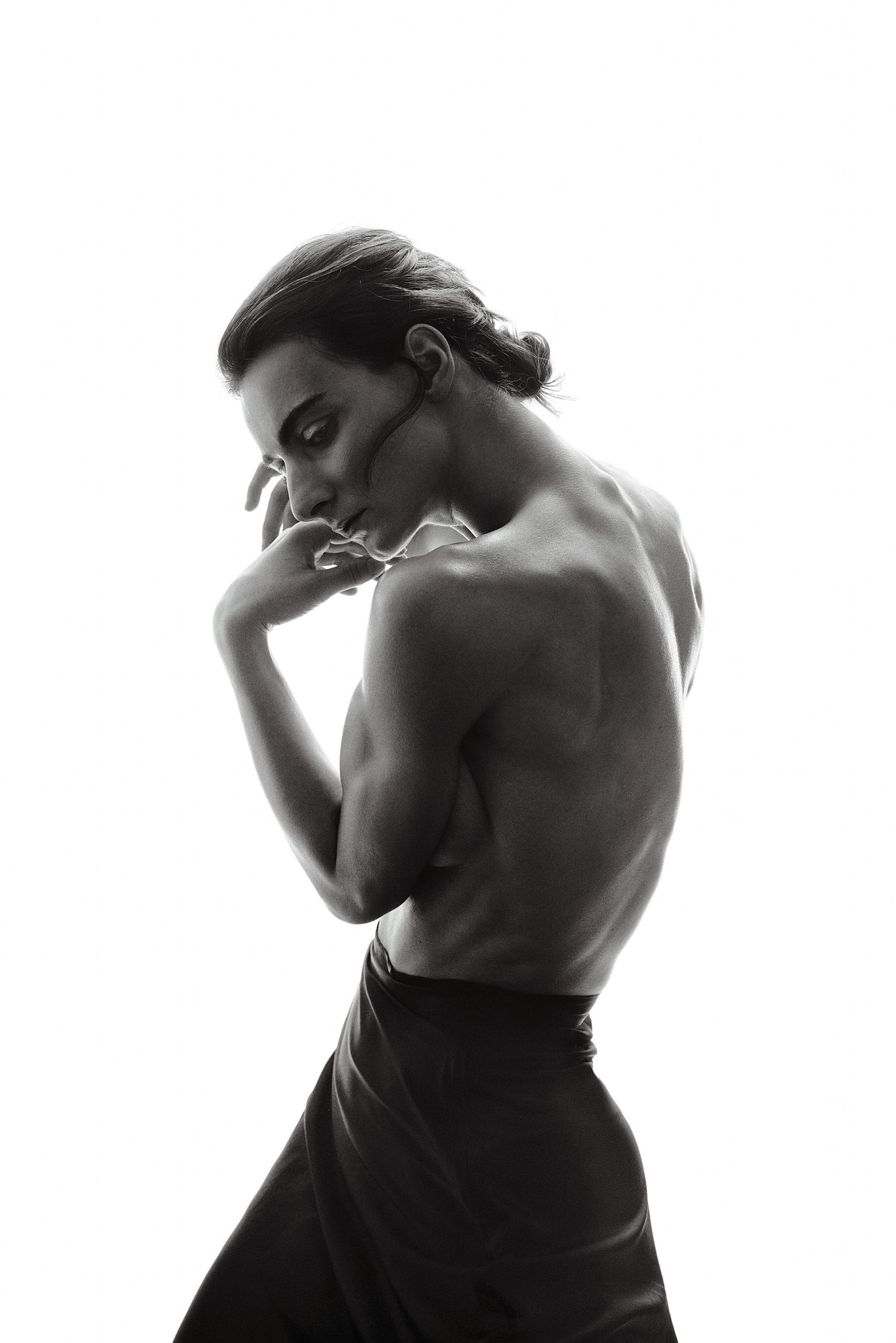 a man with a hand on his face