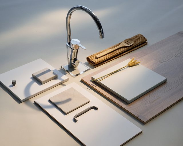a faucet and wood chopping boards