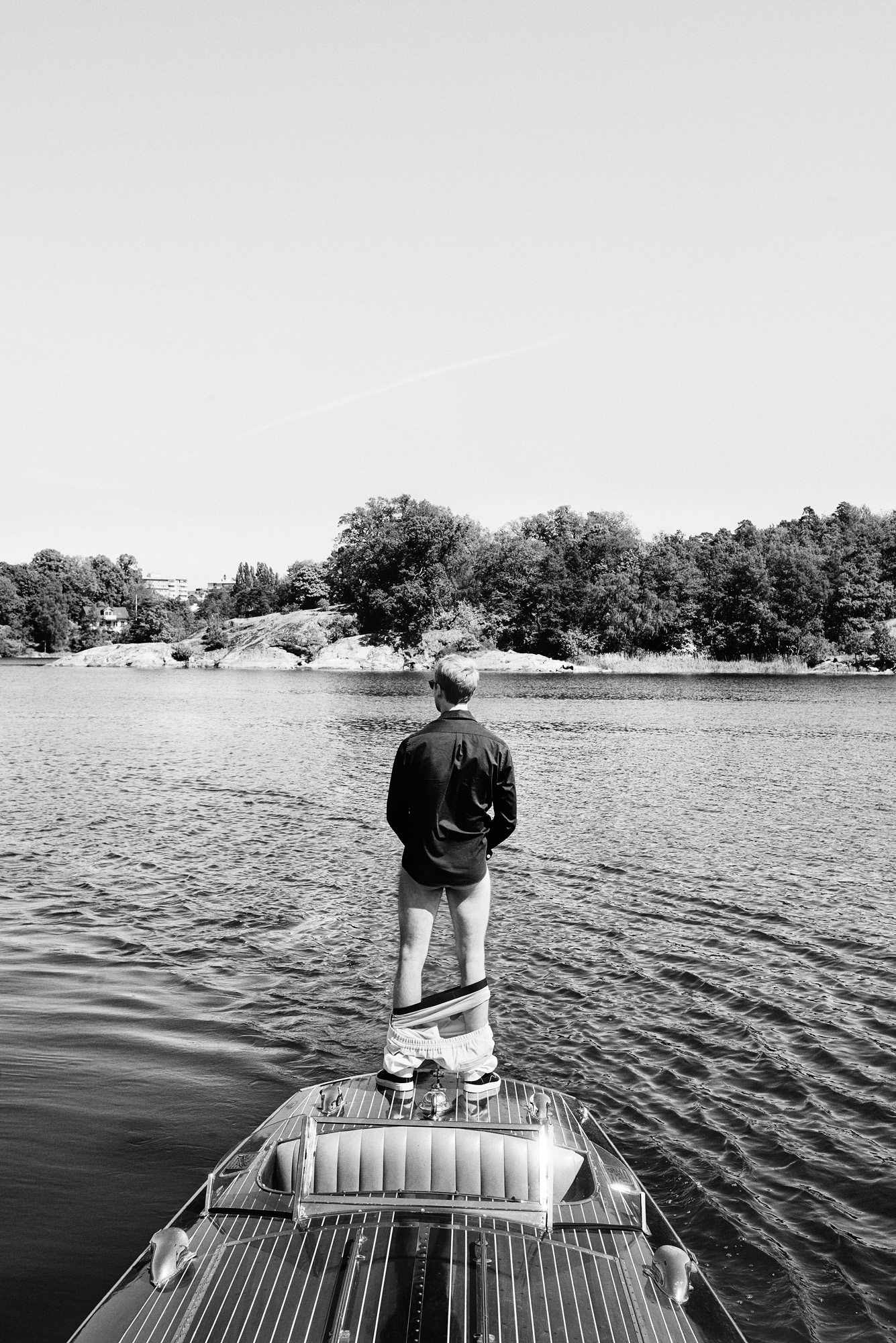 a man standing on a boat in the water