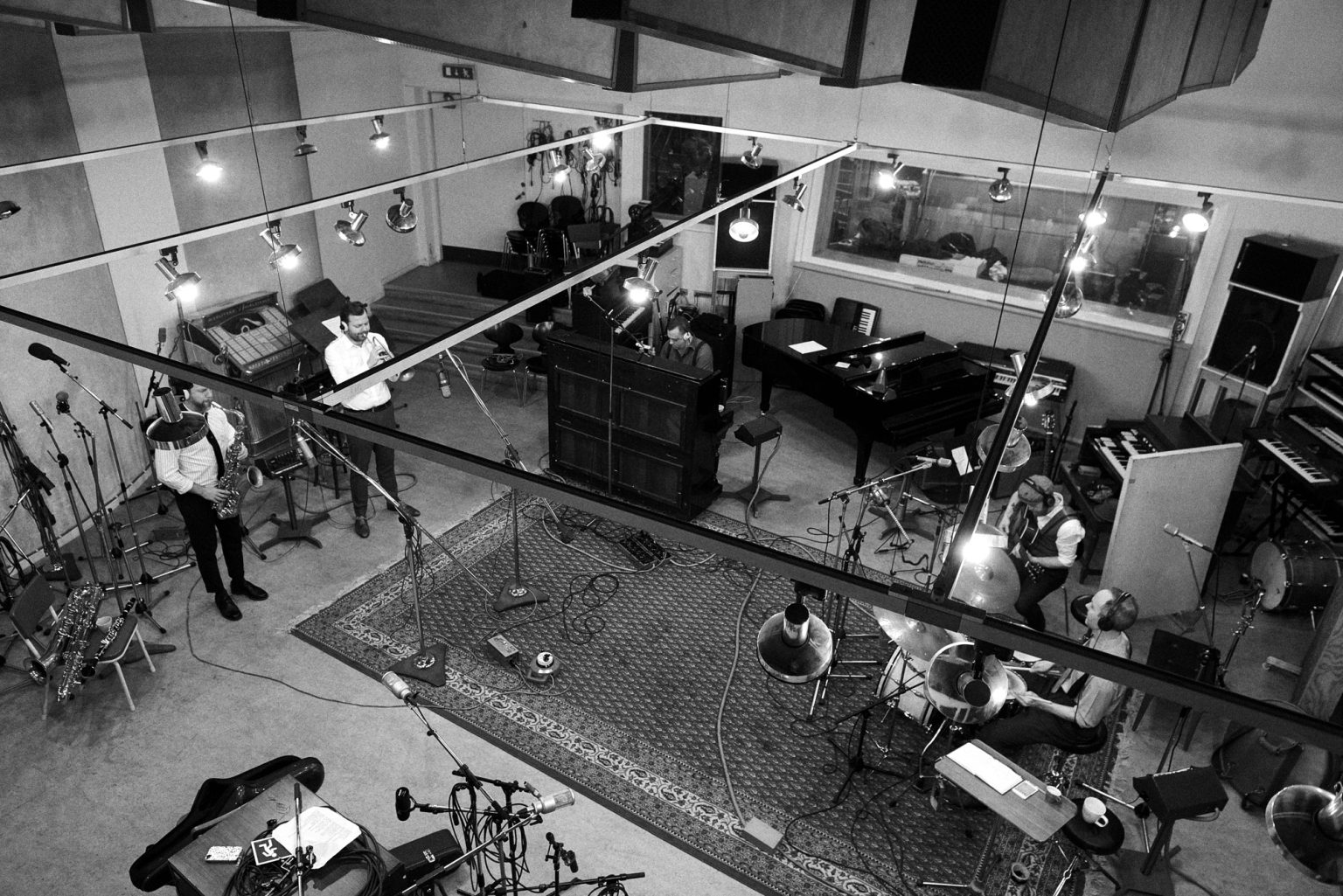 a group of people in a recording studio