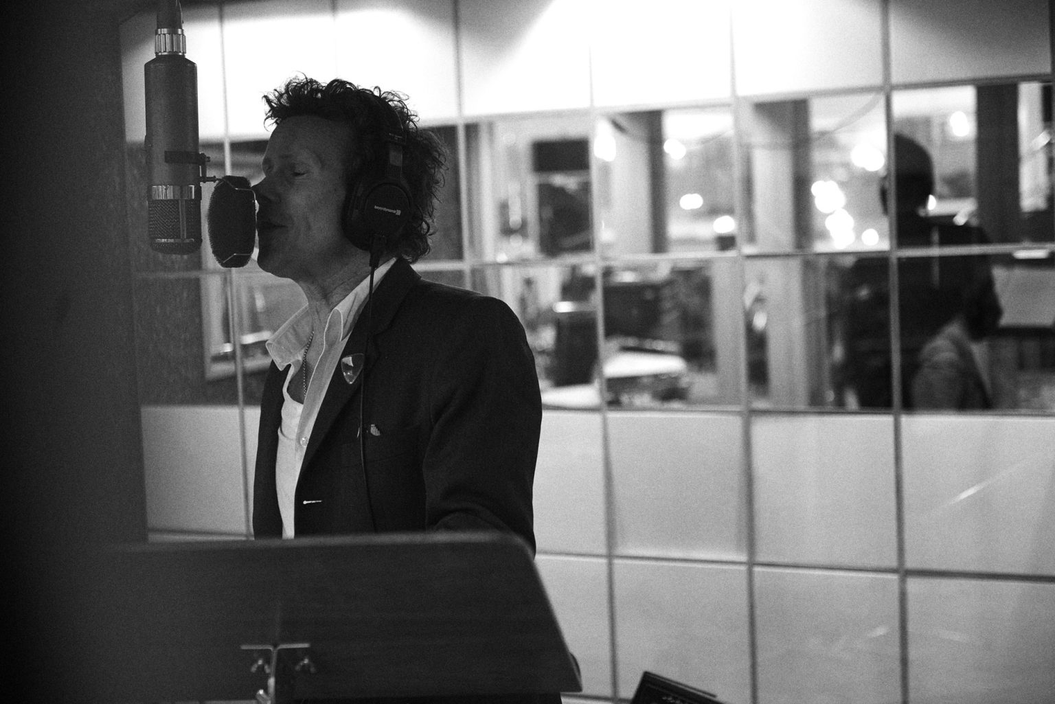 a man singing into a microphone