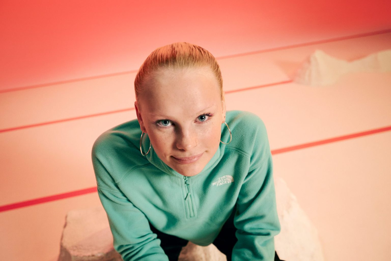 a woman in a green sweatshirt