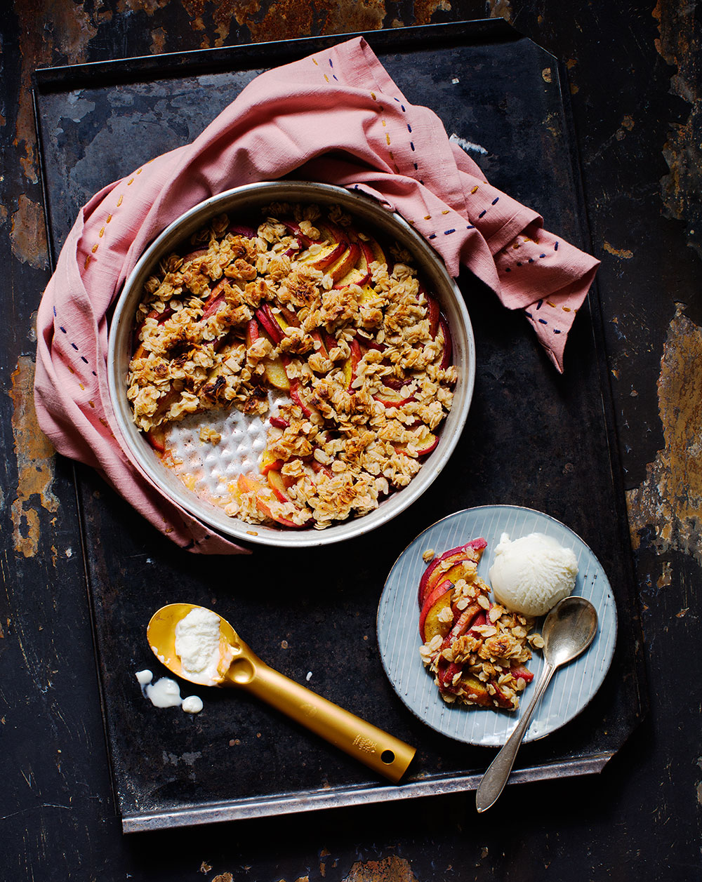 a bowl of food with a spoon and a plate of ice cream