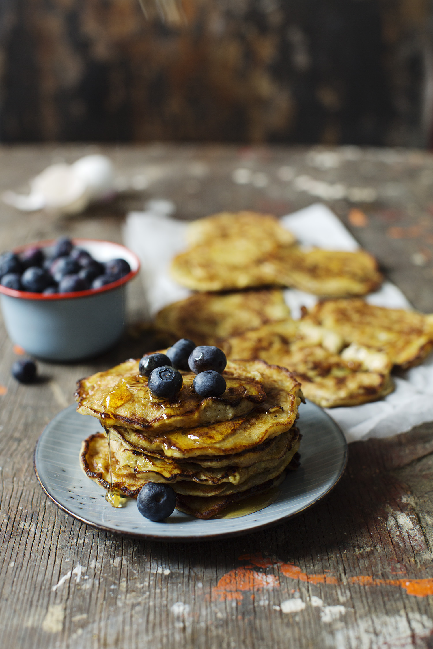 a stack of pancakes with blueberries on top